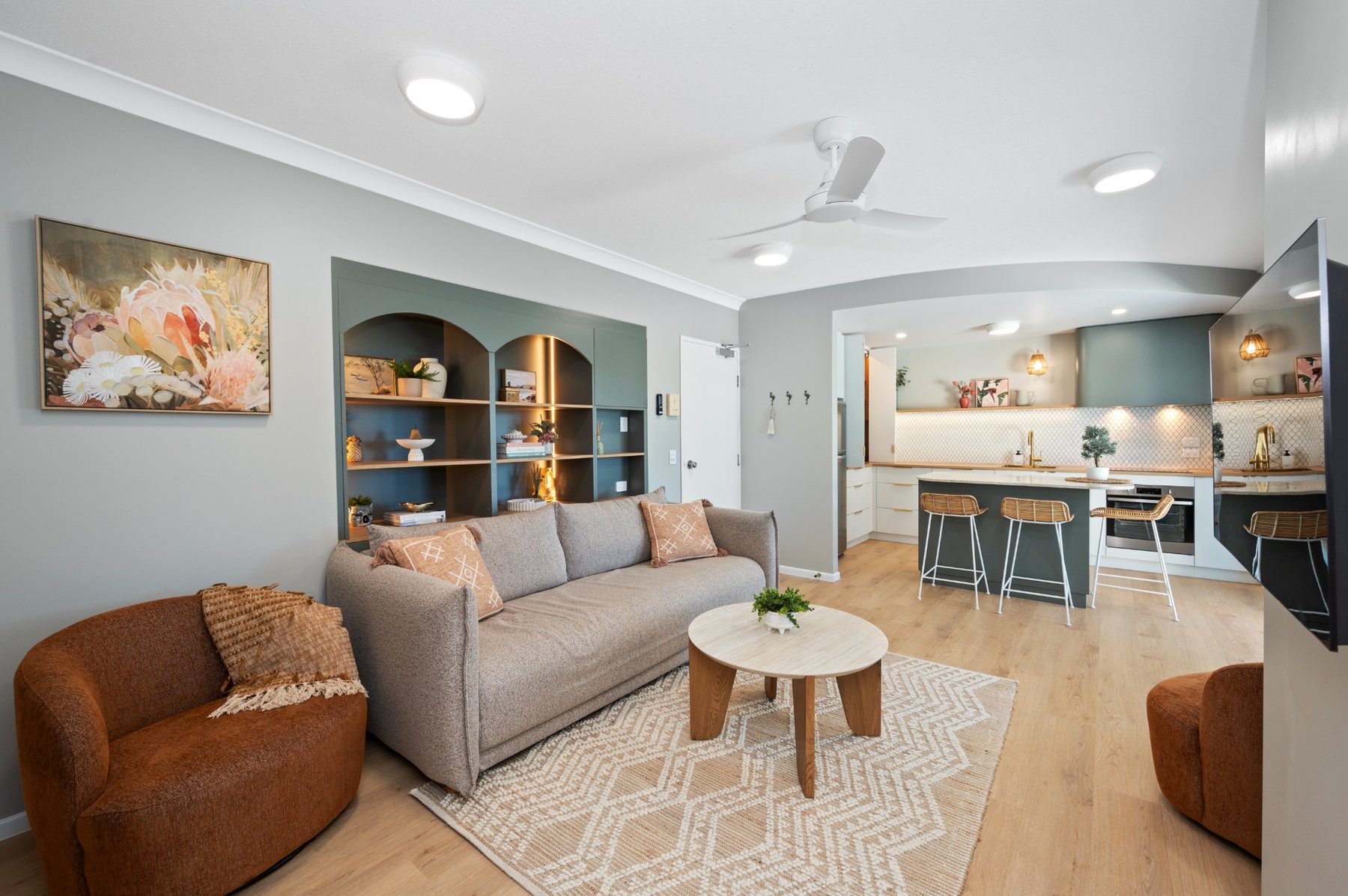 Open-plan living room and designer kitchen inside Koola Palms Apartment 101 in Bargara